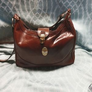 ValentinA brown leather made in Italy. Zip and latch gently used. Pet/smoke free